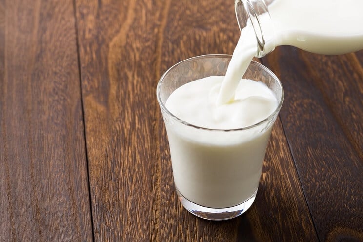 milk pouring into a glass