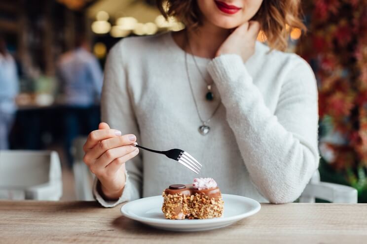 woman eating dessert