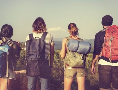 young adults traveling with backpacks