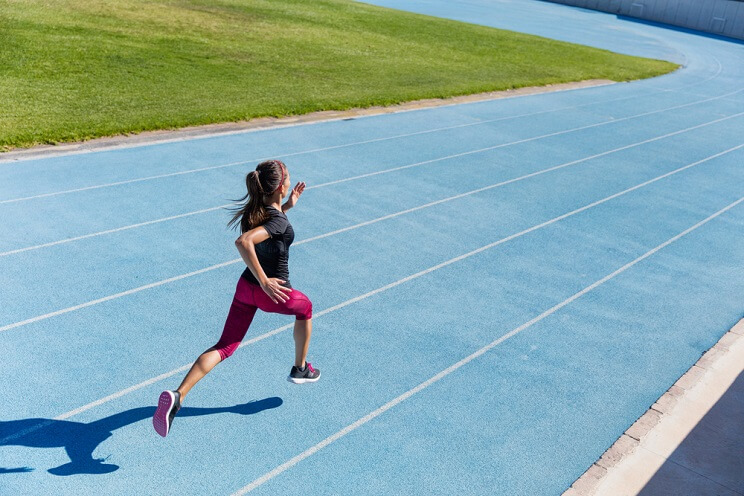 woman running on a track