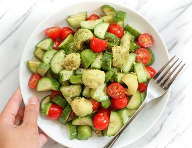 This cool cucumber caprese salad is filled with juicy cherry tomatoes and creamy avocado, and takes only a few minutes to toss together.