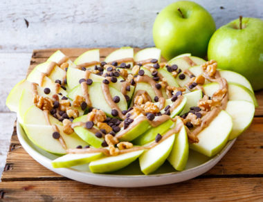 Nachos get a sweet makeover with crunchy apples, rich dark chocolate, and a naturally sweet, 4-ingredient Paleo caramel sauce!
