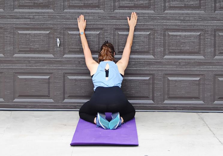 4 Spinal Stretches You Can Do Against a Wall (Soothe Back Pain, Increase Mobility)
