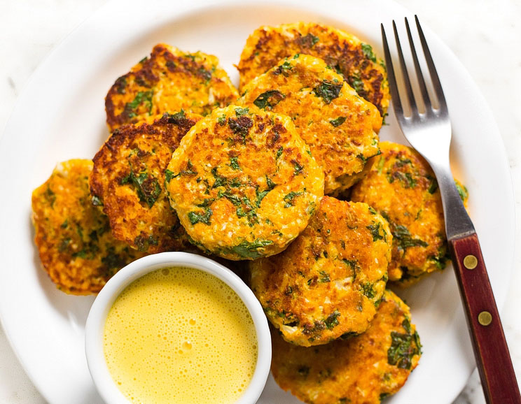 Sweet potato and kale come together to make a crispy fritter just begging to be dipped in a creamy garlic aioli!