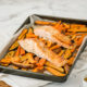 An honest look at the actual difference between wild and farmed salmon, the benefits of this popular dish and how to cook it to perfection with a one-pan salmon dinner recipe.