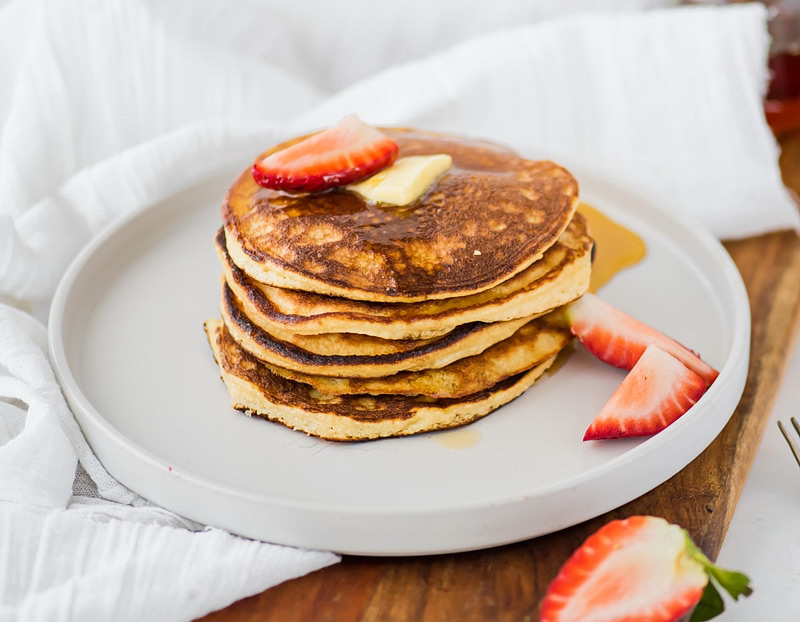 Try these delicious paleo coconut flour pancakes - made completely grain free & gluten free. Enjoy these tasty Paleo pancakes with some maple syrup!