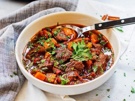 Settle in with a warm bowl of hearty beef tagine slow cooked in Moroccan spices and herbs for a hearty and nourishing meal.